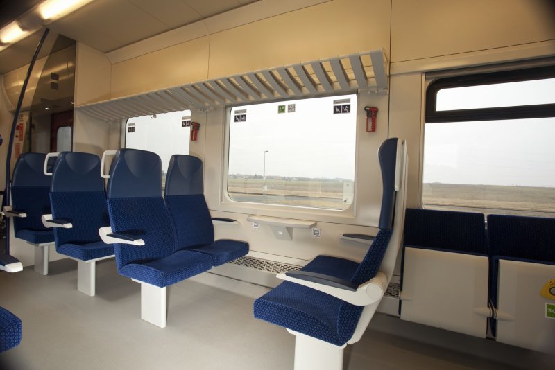 Поезд Ласточка внутри вагона с туалетом