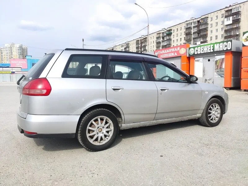 Nissan Wingroad 2001 вид сбоку