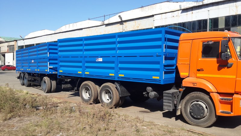 КАМАЗ 65115 зерновоз с прицепом бортовой