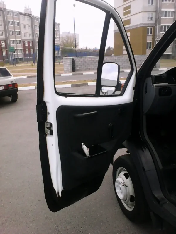 Обшивка двери Газель 3302
