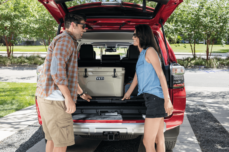 Porters put put Cargo in the car