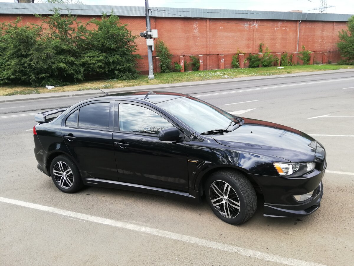 Mitsubishi lancer черный. Mitsubishi Lancer 10 черный. Митсубиси Лансер 10 черный. Митсубиси Лансер 10 черный тонированный. Лансер 10 черный седан.