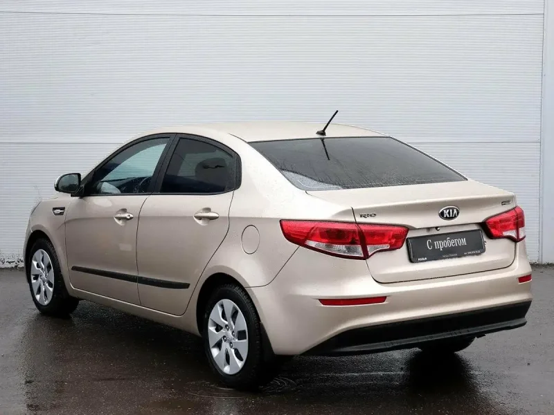 Kia Rio 3 бежевая черные диски