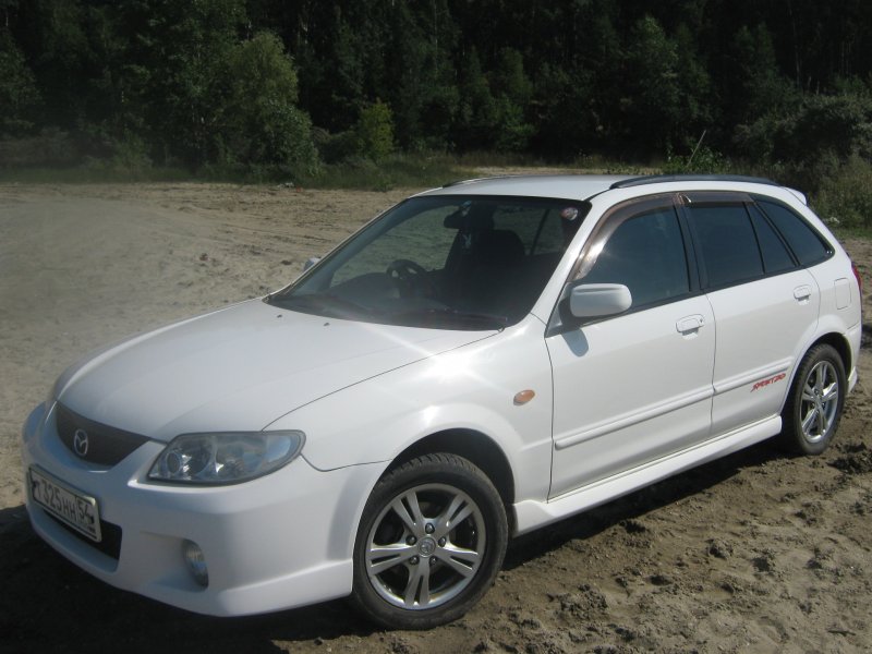 Mazda familia 2003 хэтчбек Restyling