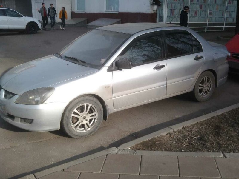 Митсубиси Лансер 2003 белый
