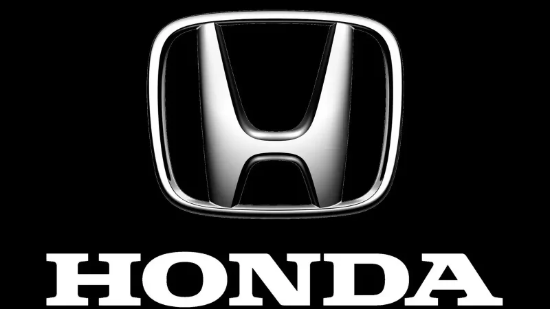 Значок Хонда на черном фоне
