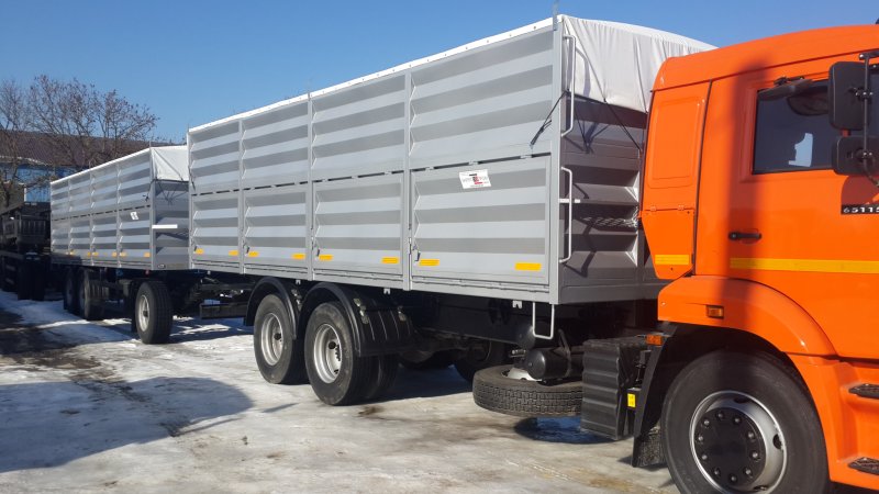 КАМАЗ 65115 зерновоз с прицепом бортовой