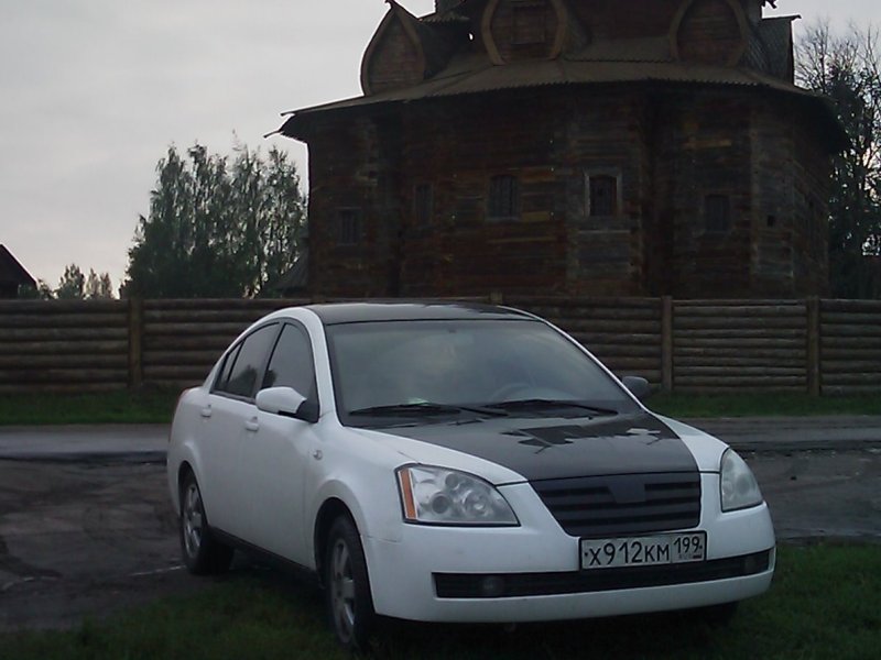 Гос.номер х412ах Chery fora бежевая