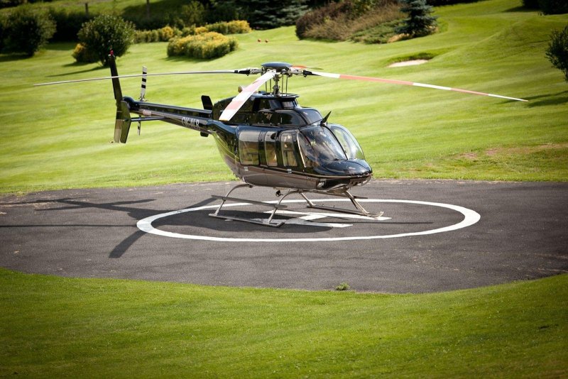 Bell 407 вертолёт зеленый