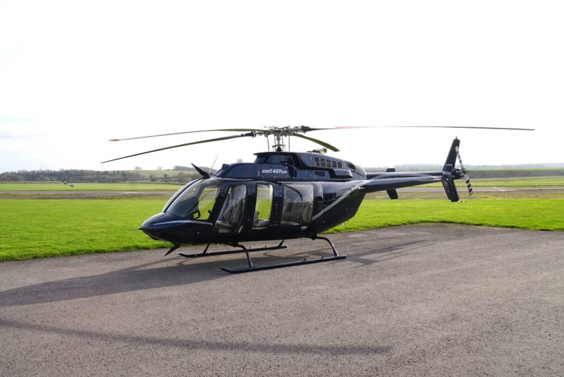 Bell 407 вертолёт зеленый