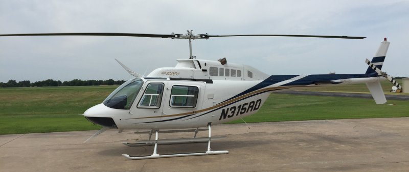 Вертолет Bell 206 с пулеметом